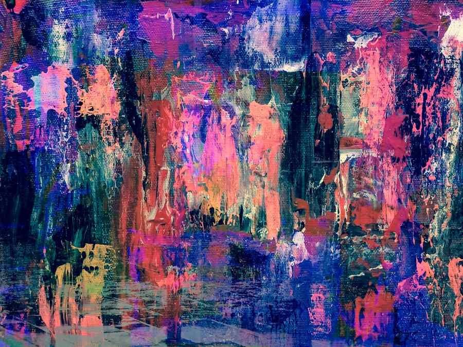 Close-up of a colorful abstract painting on canvas with visible woven texture under the paint